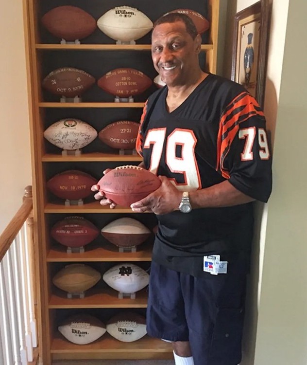Ross Browner holding football from his singleton in 1983 while with the Cincinnati Bengals.